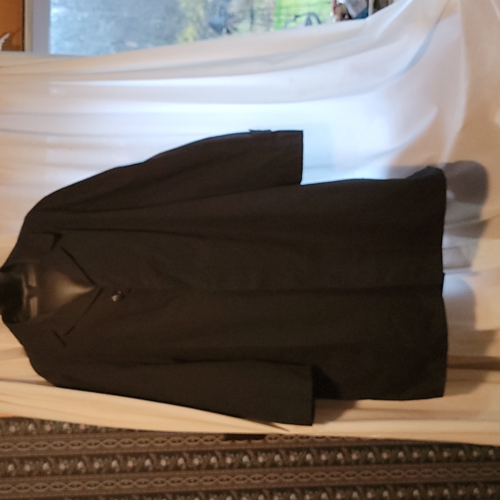 Women's rain coat. Size XL. Black with a greenish plaid liner.